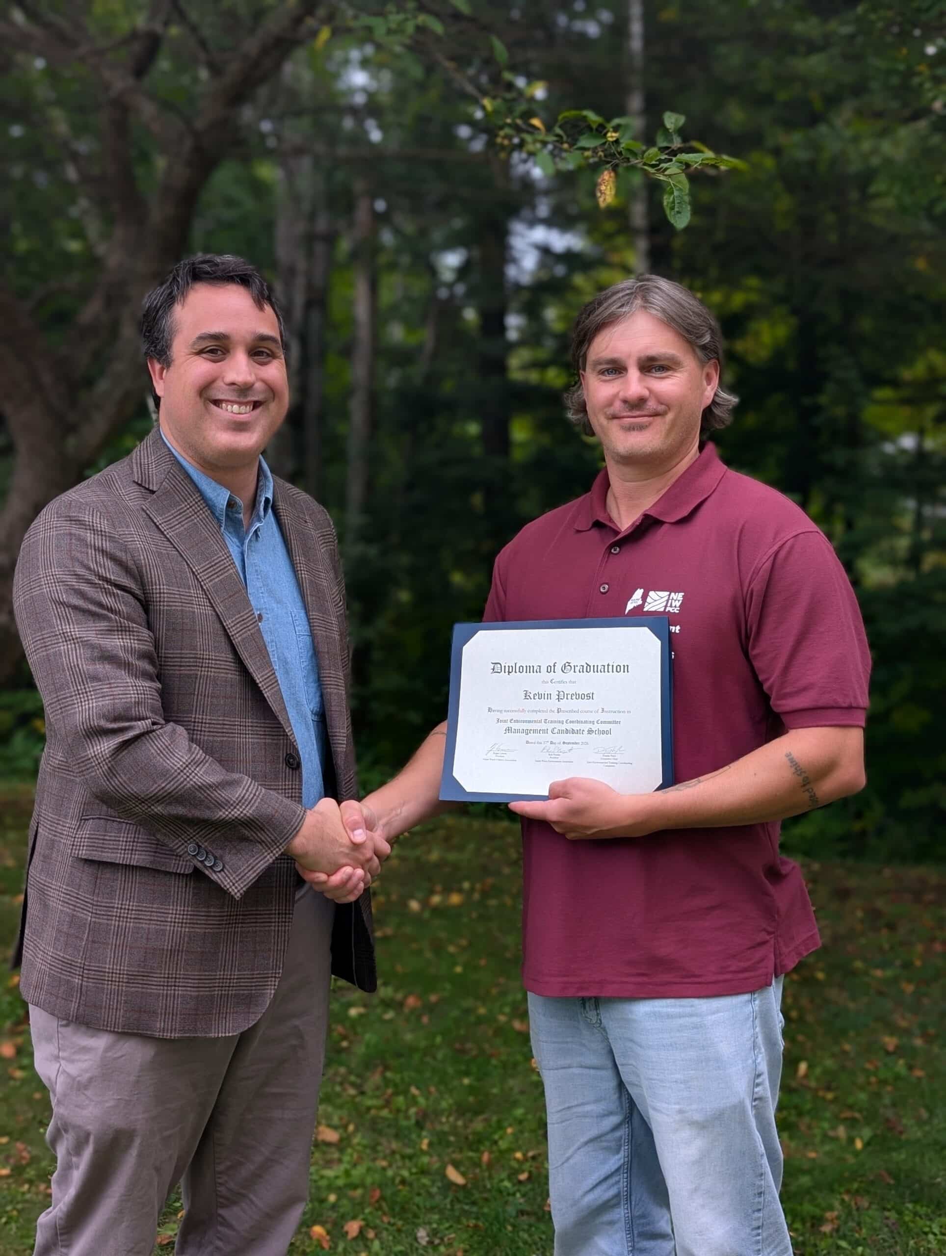 Kevin Prevost of Rumford-Mexico Sewerage District accepts his JETCC Management Candidate School certificate from Brett Willard. Kevin Prevost of Rumford-Mexico Sewerage District accepts his JETCC Management Candidate School certificate from Brett Willard.